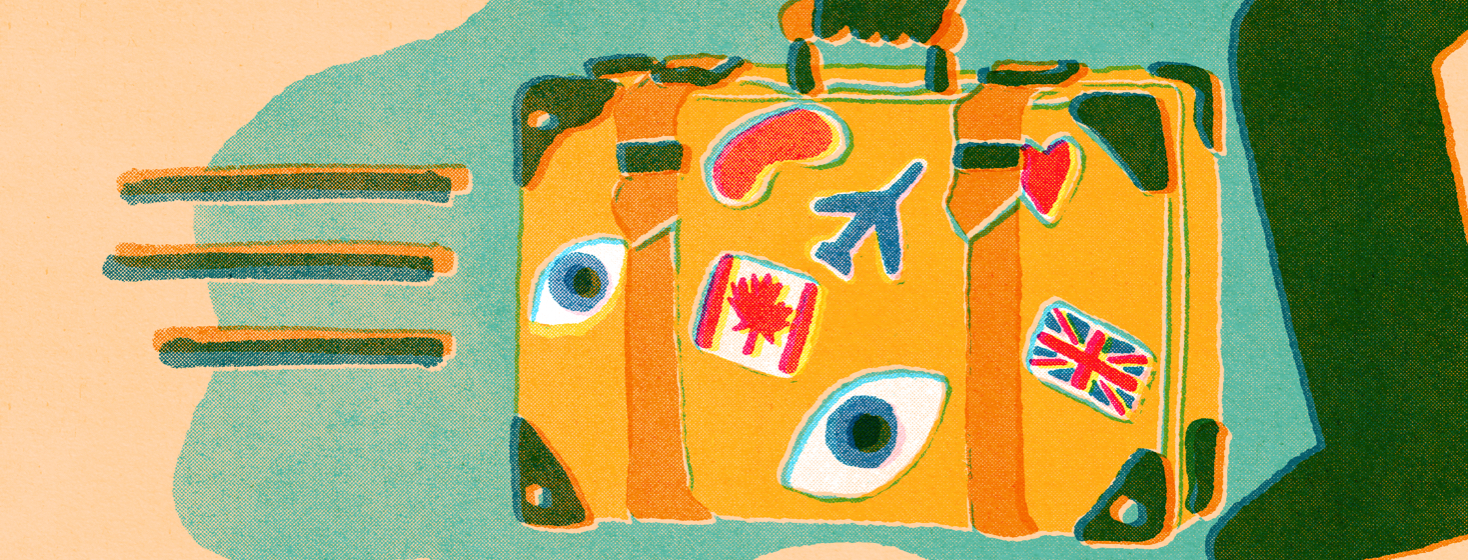 A suitcase with multiple stickers on it including a canadian flag, uk flag, some eyes, and an eye mask.