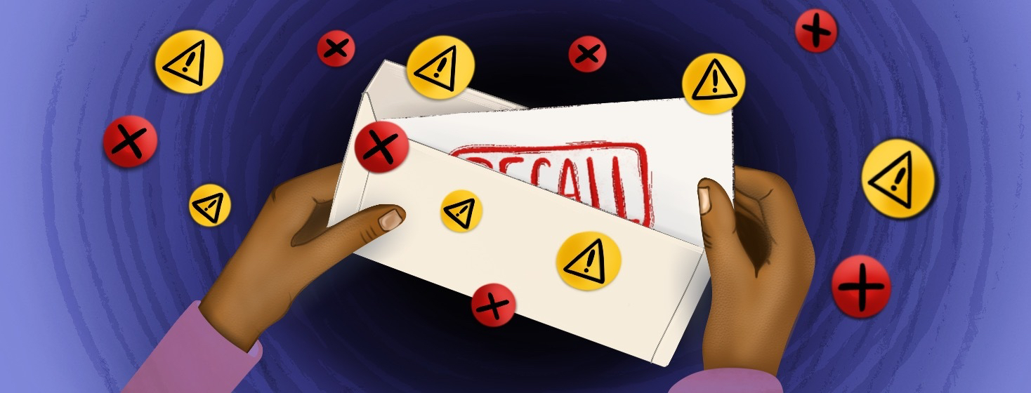 Hands holding a letter that says "RECALL".
